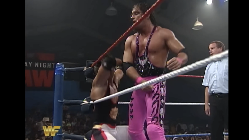 Bret Hart executing a technical wrestling maneuver during match breakdown featured on James Derek Media.
